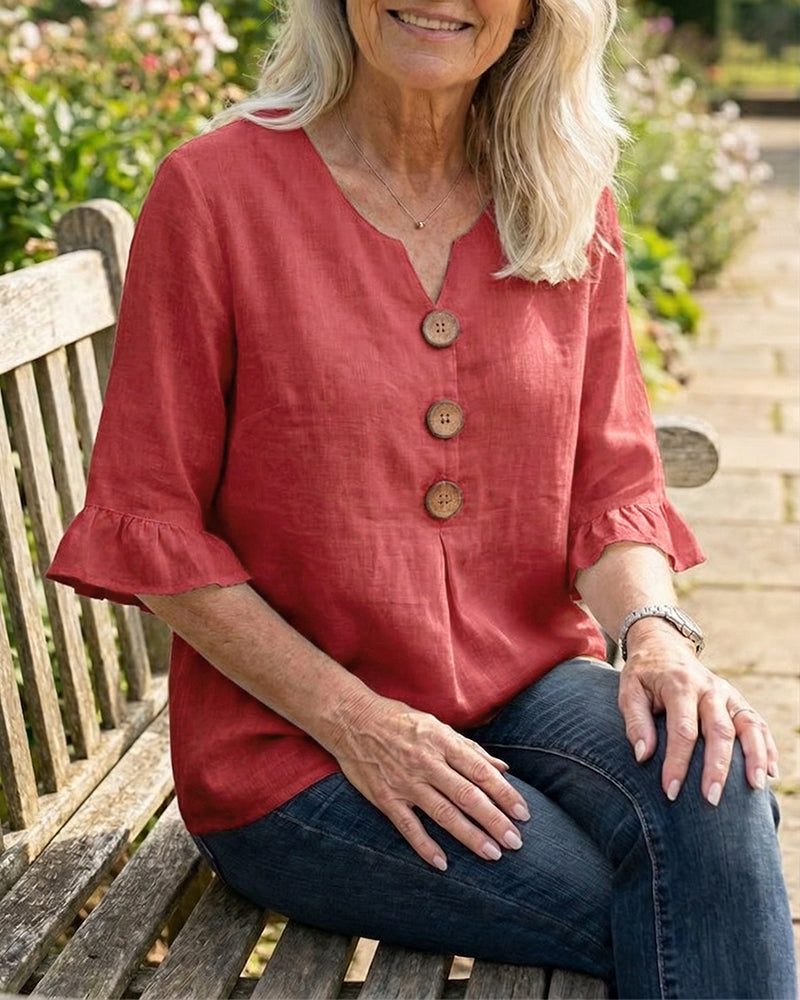 Blusa liscia in cotone e lino con bottoni in legno e volant