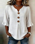 Blusa liscia in cotone e lino con bottoni in legno e volant