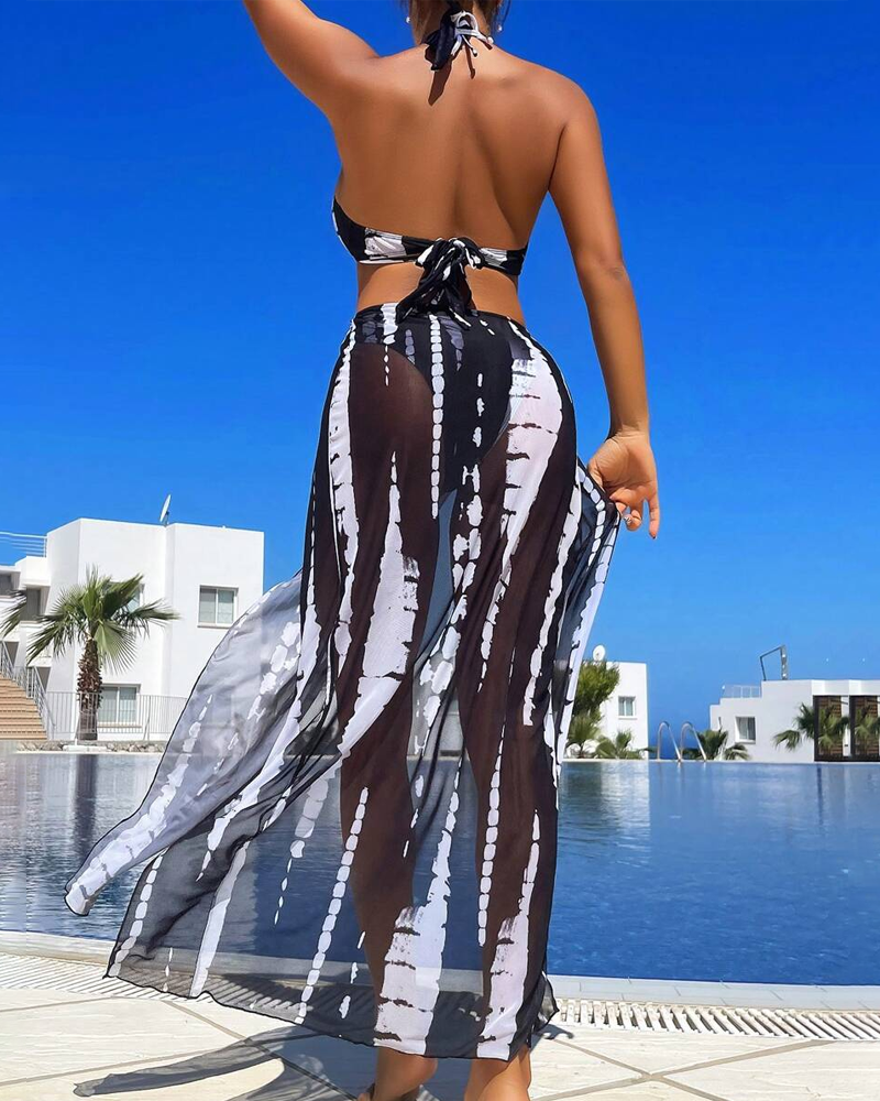 Bikini sexy amb estampat contrastant i detall de anell, amb faldilla maxi de platja