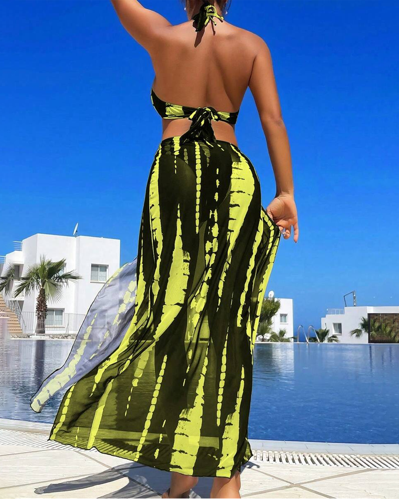 Bikini sexy amb estampat contrastant i detall de anell, amb faldilla maxi de platja
