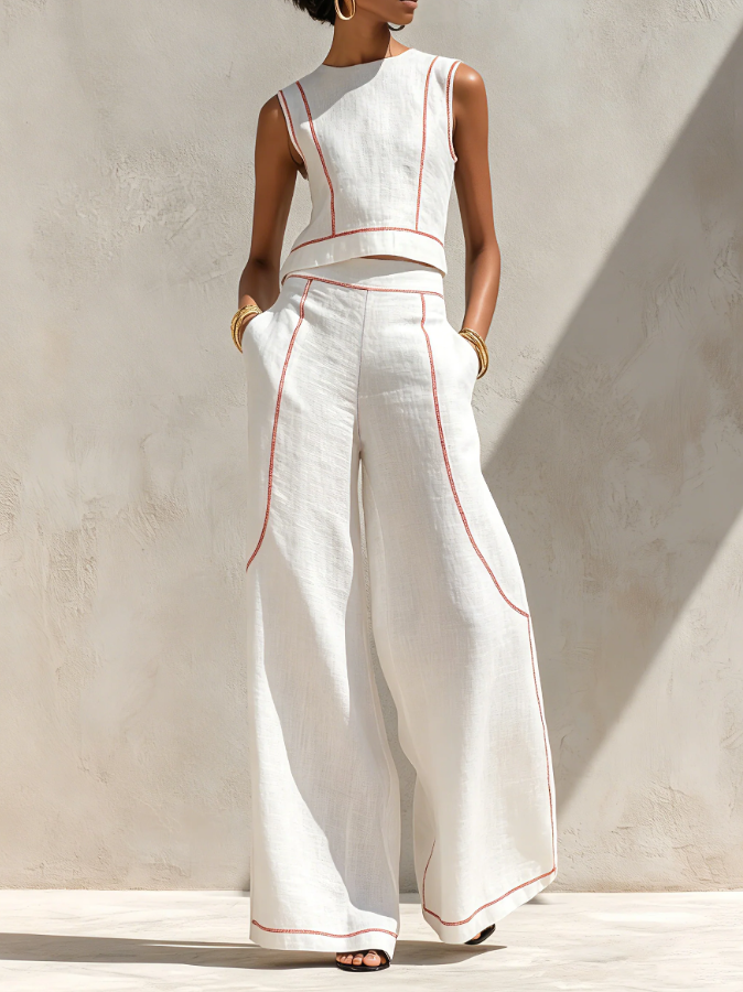 Conjunt blanc amb top sense mànigues i pantalons de cama ampla