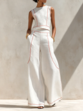 Conjunt blanc amb top sense mànigues i pantalons de cama ampla