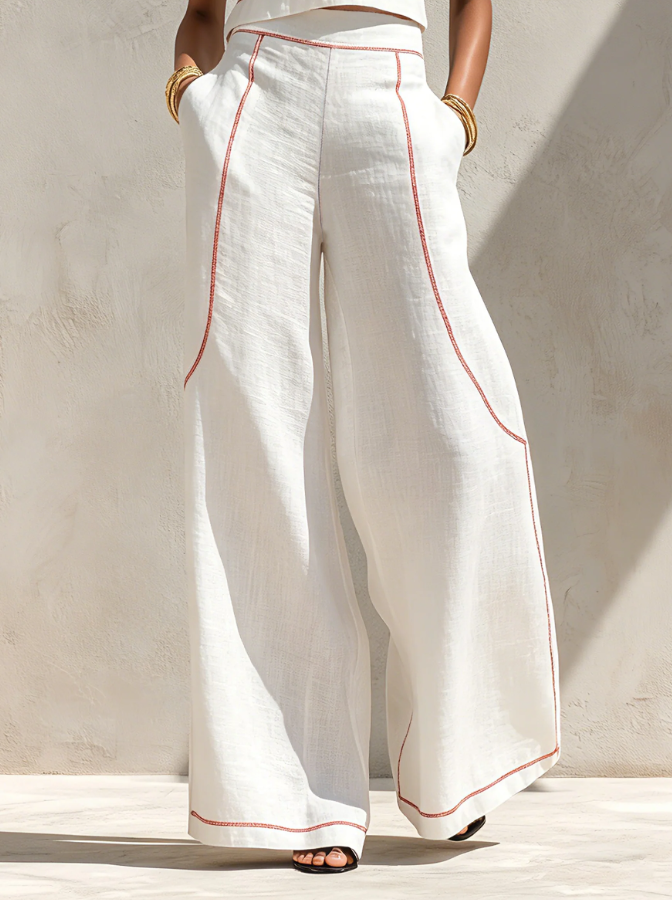 Conjunt blanc amb top sense mànigues i pantalons de cama ampla