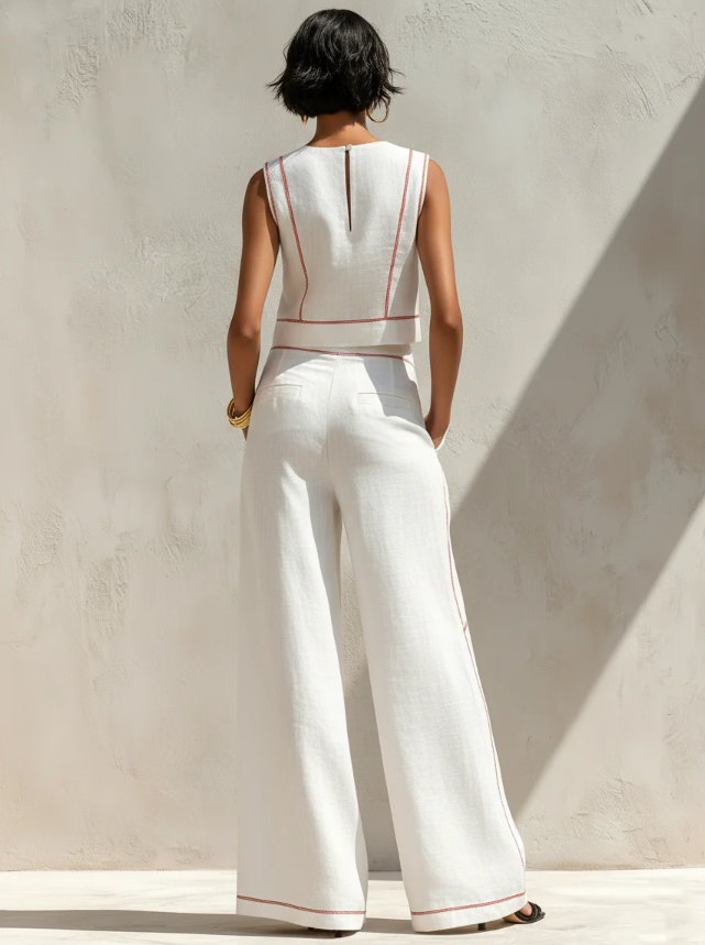 Conjunt blanc amb top sense mànigues i pantalons de cama ampla