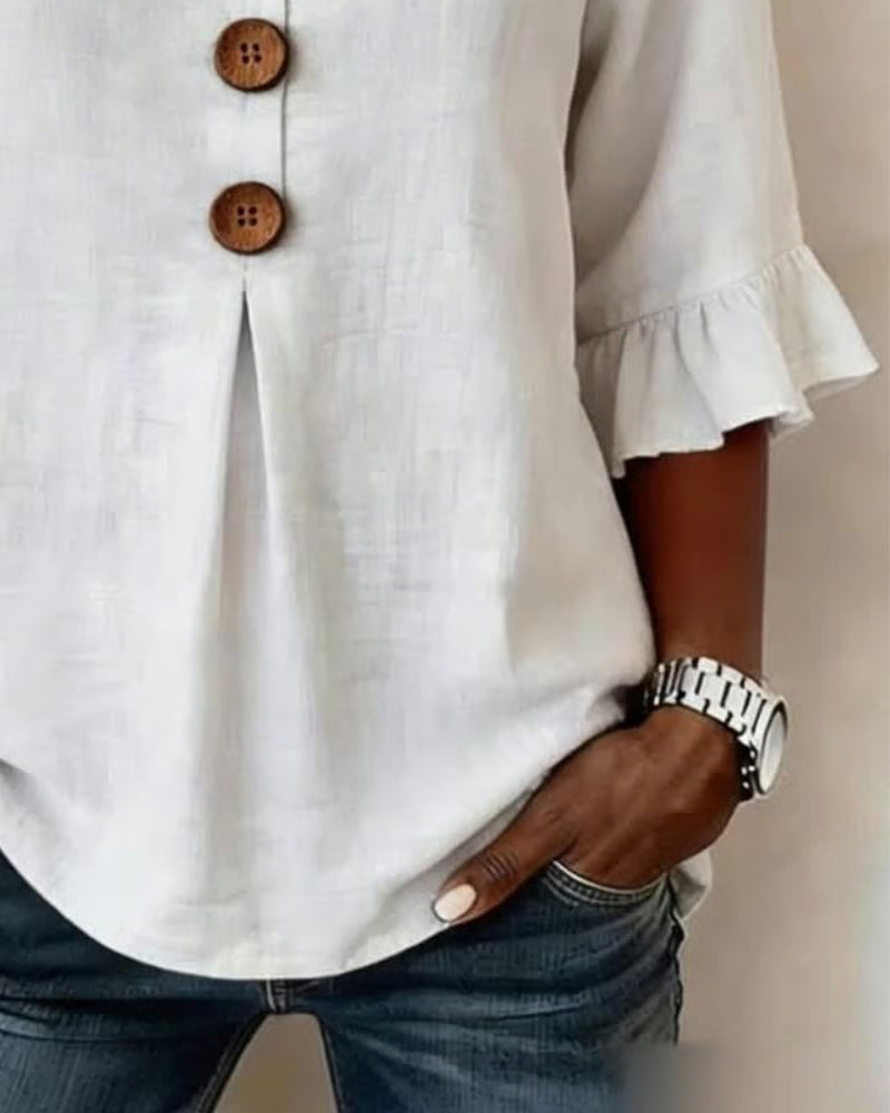 Blusa liscia in cotone e lino con bottoni in legno e volant