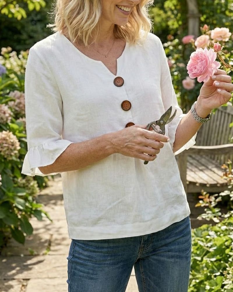 Blusa liscia in cotone e lino con bottoni in legno e volant