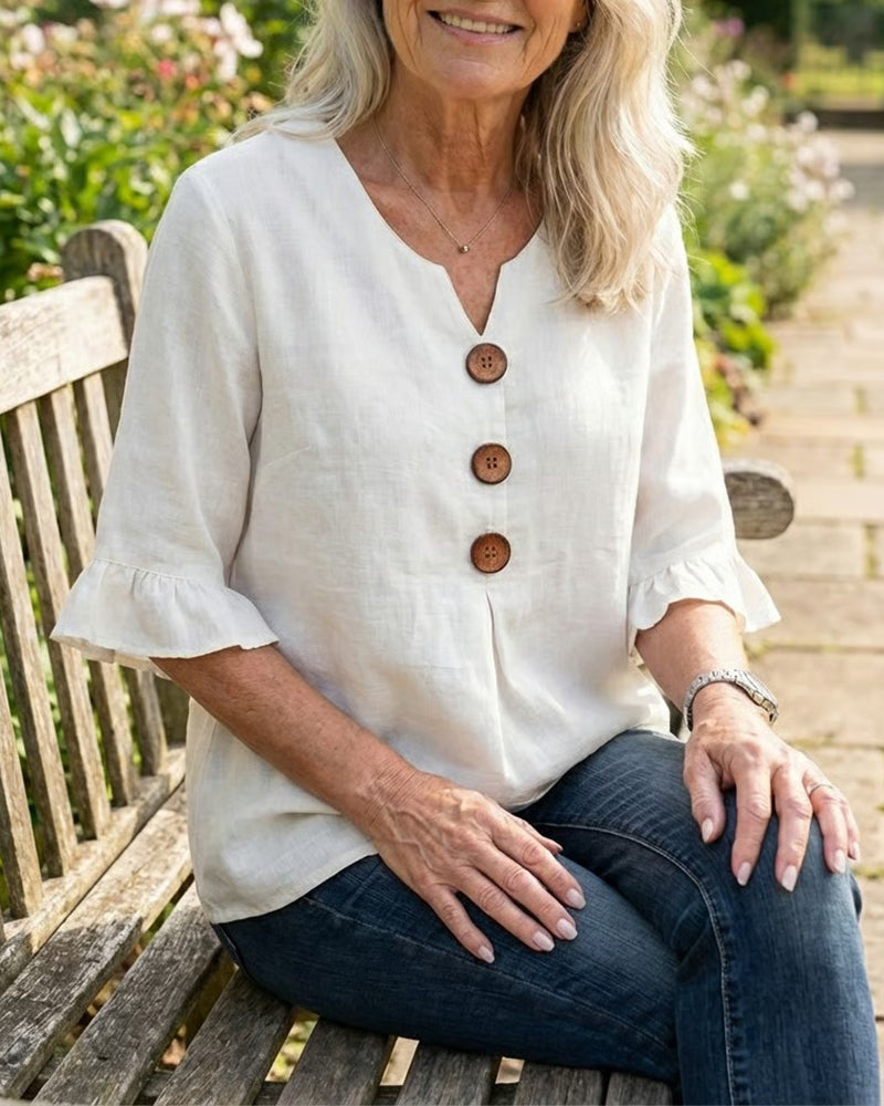 Blusa liscia in cotone e lino con bottoni in legno e volant