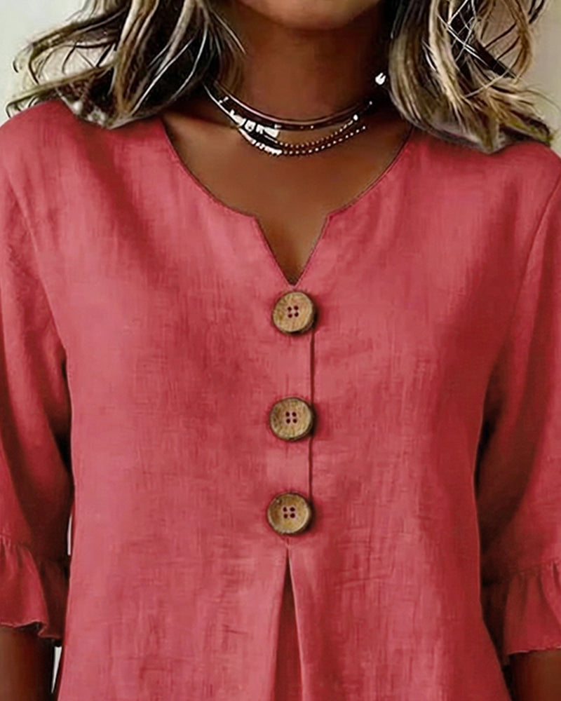 Blusa liscia in cotone e lino con bottoni in legno e volant