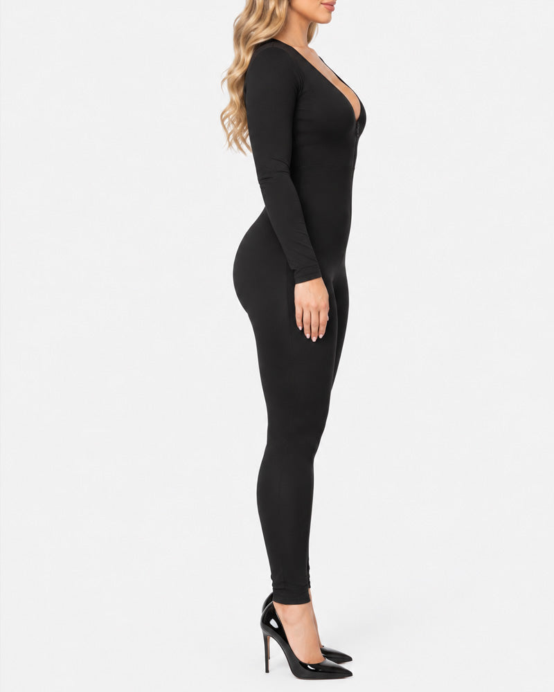 Tuta modellante a maniche lunghe con scollo profondo a V, zip frontale, tessuto altamente elasticizzato, effetto tummy control e slanciaculotte