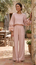 Ensemble composé d’un haut à poignets fleuris et d’un pantalon à jambes larges