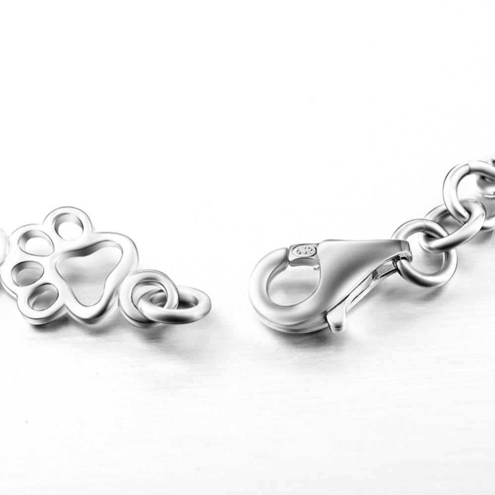 Bracelet avec breloques empreinte et os en argent