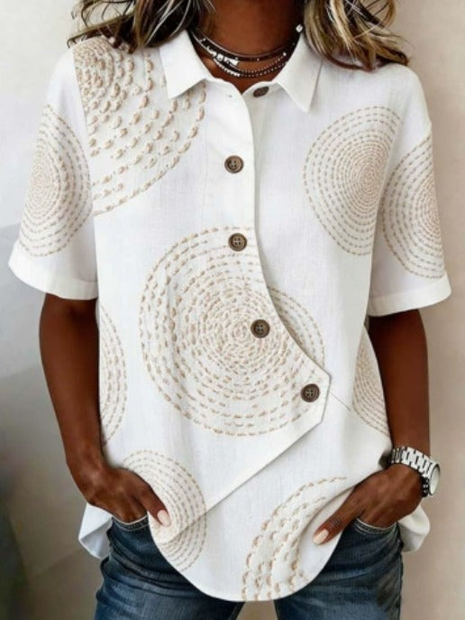 Asymmetrisk bluse i bomull og lin med knapper