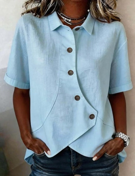 Asymmetrisk bluse i bomull og lin med knapper