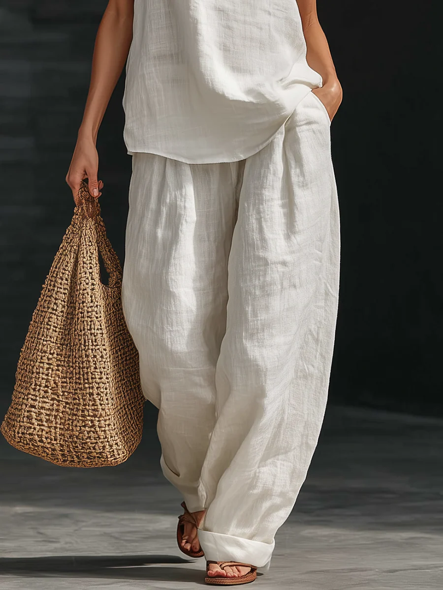 Completo elegante senza maniche con pantaloni a gamba larga