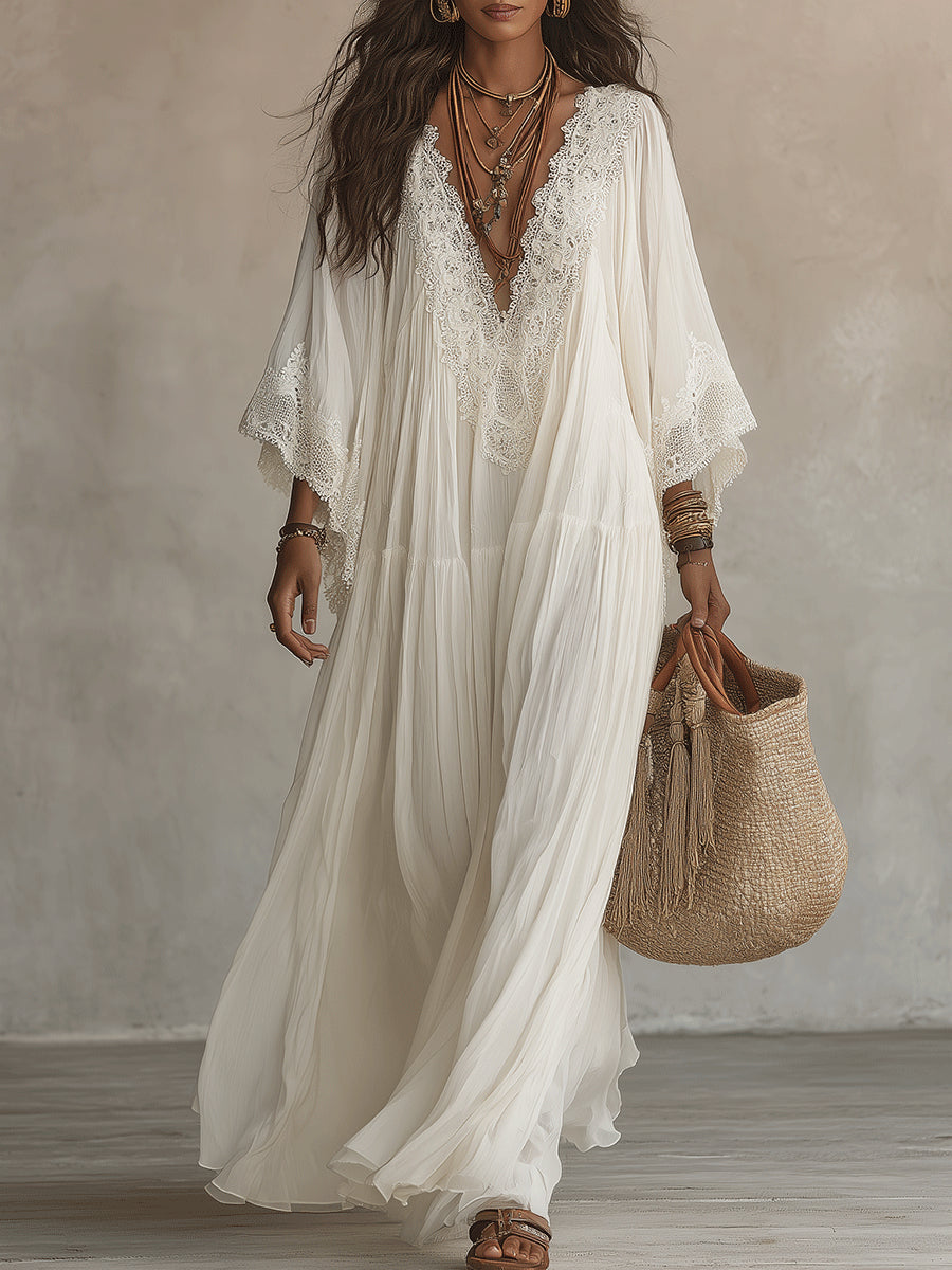 Vestido largo de gasa color marfil con mangas de murciélago y encaje blanco