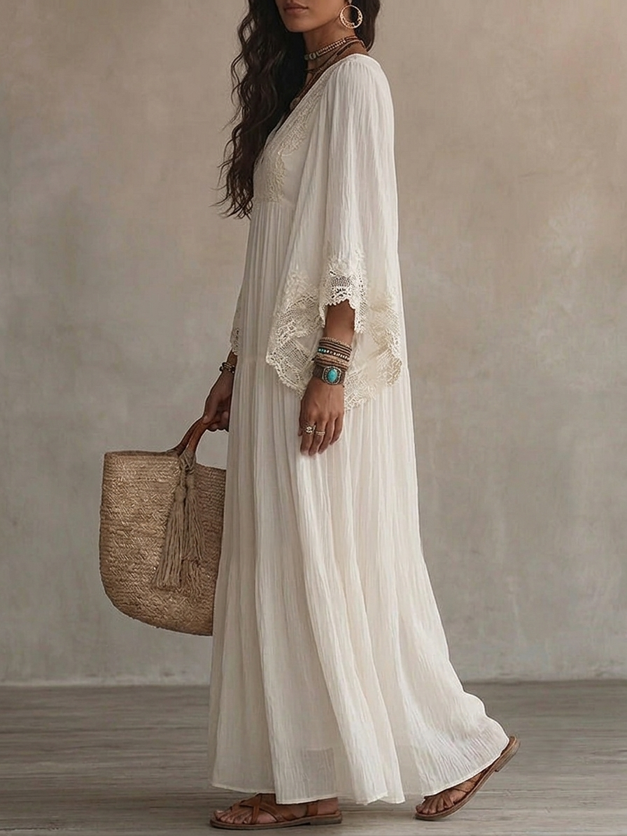Vestido largo de gasa color marfil con mangas de murciélago y encaje blanco