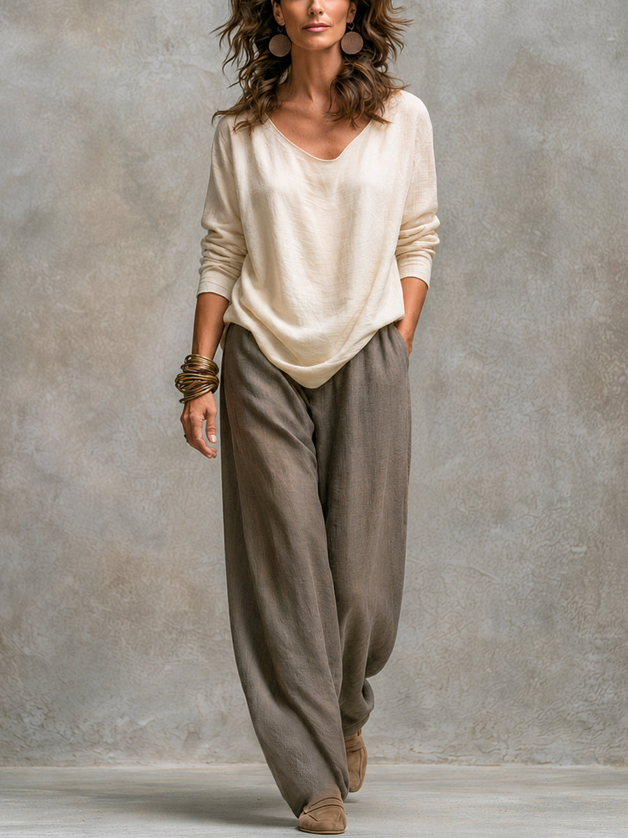 Completo di tre pezzi con pantaloni palazzo beige e grigi