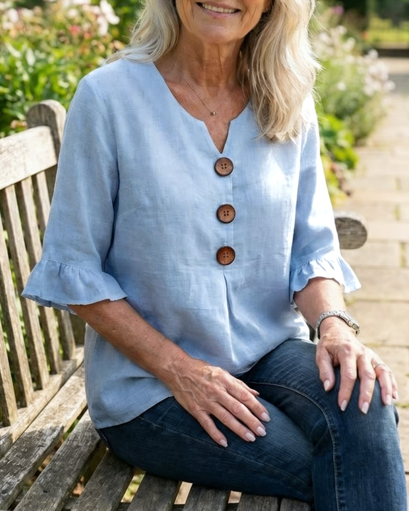 Blusa liscia in cotone e lino con bottoni in legno e volant