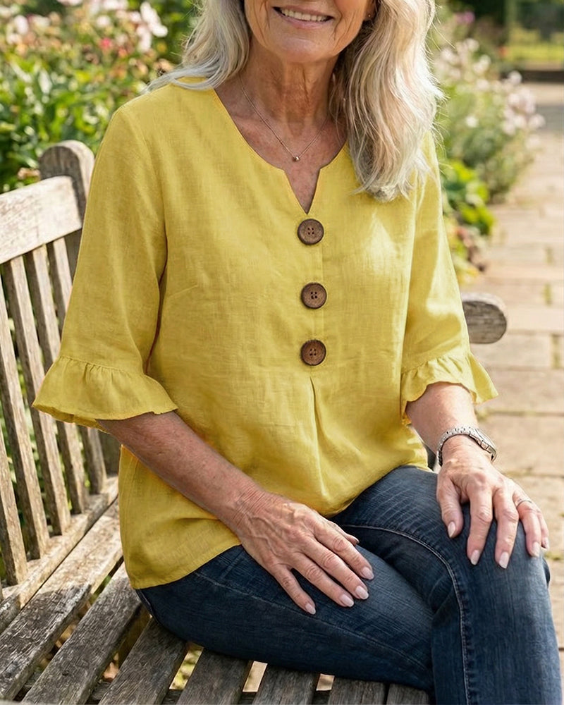 Blusa liscia in cotone e lino con bottoni in legno e volant