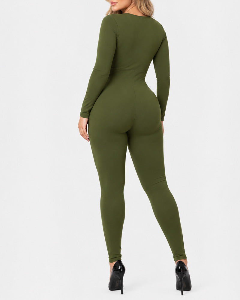 Tuta modellante a maniche lunghe con scollo profondo a V, zip frontale, tessuto altamente elasticizzato, effetto tummy control e slanciaculotte