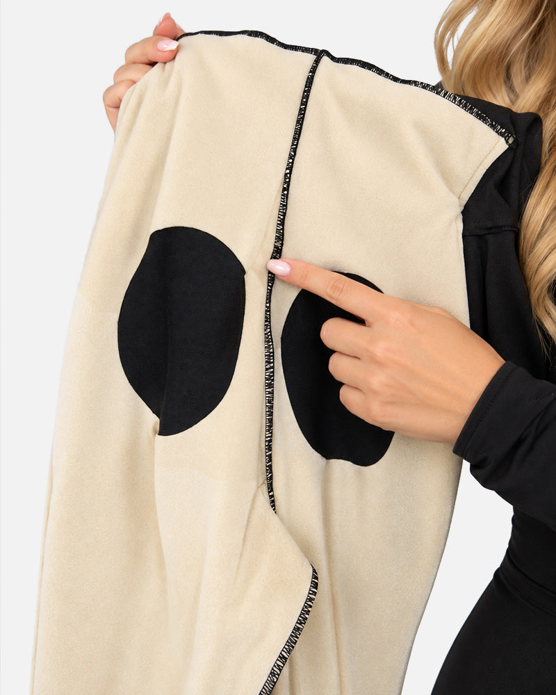 Tuta modellante a maniche lunghe con scollo profondo a V, zip frontale, tessuto altamente elasticizzato, effetto tummy control e slanciaculotte