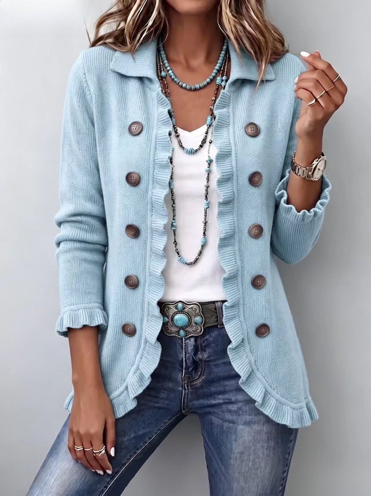 Chaqueta de punto azul empolvado con volantes