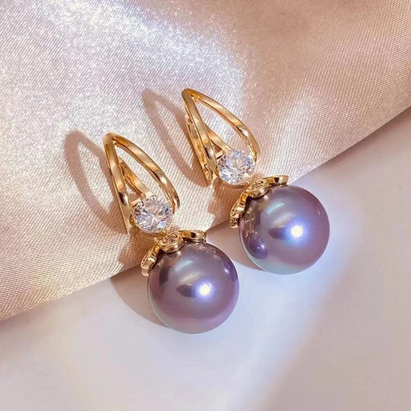 Arracades llargues de perles brillants per a dona