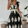 Vestit llarg i fluid de dona amb coll en V i estampat barroquet
