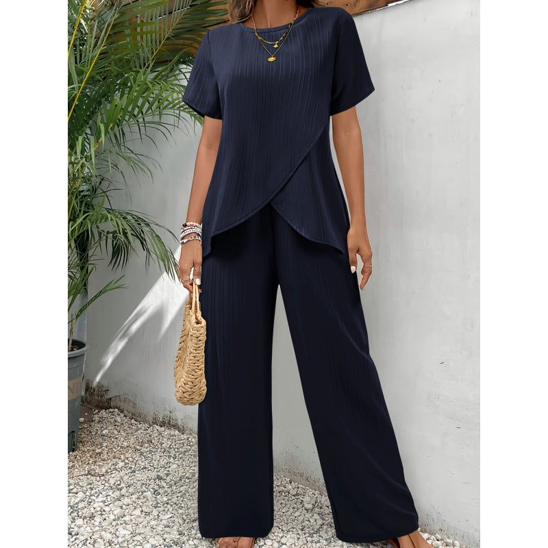 Completo con top asimmetrico e pantaloni a gamba larga