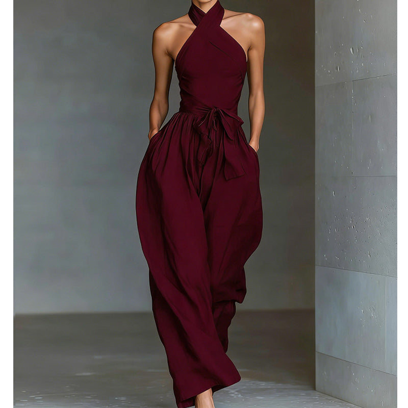 Elegant ermeløs jumpsuit med åpen rygg og snøring i livet