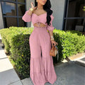 Completo crop top e pantaloni a balze