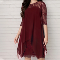 Vestit elegant de renda amb orllat asimètriu